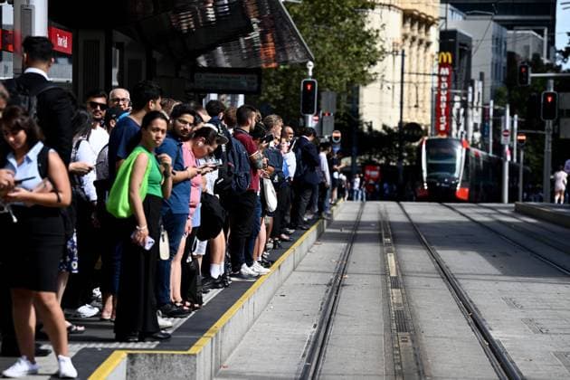 SYDNEY TRAINS DISRUPTION, Commuters are seen waiting for light rail services after Town Hall station was closed due to a network communication issue, with delays expected across the transport network in Sydney, Wednesday, March 8, 2023. ( NO ARCHIVING, EDITORIAL USE ONLY, NO USE IN BOOKS WITHOUT CONSENT Sydney NSW AUSTRALIA  Copyright: xDANxHIMBRECHTSx 20230308001772635803