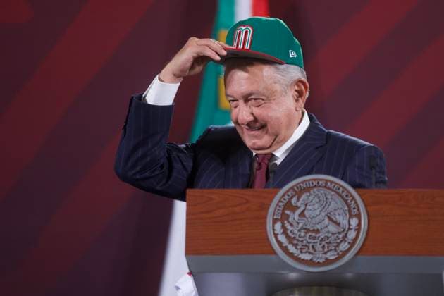 Mexican President, Lopez Obrador News Conference March 10, 2023, Mexico City, Mexico: Mexico™s President, Andres Manuel Lopez Obrador, puts on a cap of Mexican baseball team during the briefing conference at National Palace. on March 10, 2023 in Mexico City, Mexico. (Photo by Julian Lopez Eyepix Group) Copyright: xJulianxLopez xEyepixxGroupx JL_10032023_89427