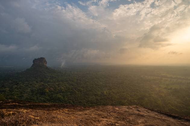 Sigiriya Rock In Sri Lanka A general view of the Sigiriya rock from Pidurangala rock on March 12, 2023, in Dambulla, Sri Lanka. Sigiriya Lion Rock is an ancient rock fortress known for its massive column of rock that reaches nearly 200 meters high. The site dates back to the reign of King Kasyapa (A.D. 473-495), who chose this site as his new capital. He decorated the walls with frescoes and built an impressive palace right on top of the rock column, accessible only through the mouth of an enormous carved lion. It is located at a distance of 178 km from Colombo and has become a popular tourist spot for foreigners from all over the world. Viewing the Sigiriya rock from the Pidurungala rock is a favorite activity of local and foreign tourists  Copyright: xThilinaxKaluthotagex originalFilename: kaluthotage-notitle230312_npVi5.jpg