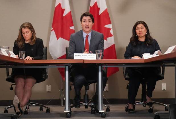 March 16, 2023, TORONTO, ON, CANADA: Canadian Prime Minister Justin Trudeau, centre, sits with Mary NG, right, Minister of International Trade, Export Promotion, Small Business & Economic Development and Chrystia Freeland, Canada s Deputy Prime Minister and Minister of Finance as they attend the NAFTA Advisory Council Meeting in Toronto, Thursday, March 16, 2023. TORONTO CANADA - ZUMAc35_ 20230316_zaf_c35_050 Copyright: xNathanxDenettex
