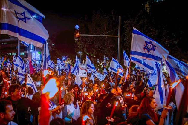 March 16, 2023, Tel Aviv, Israel: Israelis march with flags during an anti Judicial reform night protest. Israeli protesters held demonstration against a contentious government plan to overhaul the judiciary, pushing back against Prime Minister Benjamin Netanyahu after he rejected a compromise proposal that was meant to defuse the crisis. Tel Aviv Israel - ZUMAs197 20230316_zaa_s197_619 Copyright: xEyalxWarshavskyx