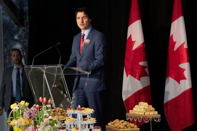 March 18, 2023, Aurora, ON, Canada: Prime Minister Justin Trudeau speaks from a podium placed next to a table displaying a Ã’Haft-sinO as he attends a Nowruz celebration with members of the Persian community, in Aurora, Ont., on Saturday, March 18, 2023. Aurora Canada  - ZUMAc35_ 20230318_zaf_c35_066 Copyright: xChrisxYoungx