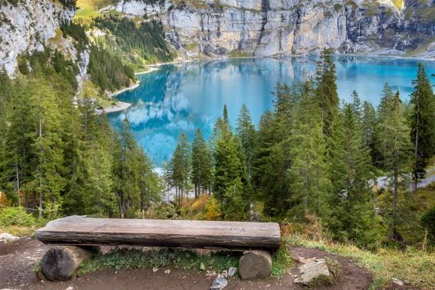 Oeschinnensee, wooden bench and Swiss Alps, Switzerland. Amazing tourquise Oeschinnensee lake, wooden bench and Swiss Alps, Berner Oberland, Switzerland. Copyright: xZoonar.com Nataliya_Nazarova{}x 18409635