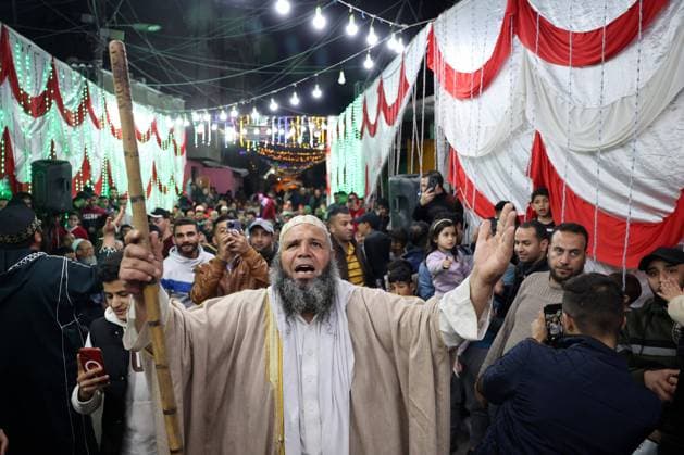 Bilder des Jahres 2023, News 03 März News Themen der Woche KW12 Palestinians take part in a festive event to celebrate Ramadan, the holiest Muslim month, two days before it starts, in Khan Yunis town in the southern Gaza Strip on Wednesday March 22, 2023. Muslims throughout the world are celebrating Ramadan, the holiest month in Islamic calendar, refraining from eating, drinking, smoking and sexual relations from dawn to dusk, It is believed that during this month the Prophet Mohammed received the revelations of the Quran.  GAZ2023032206 IsmaelxMohamad