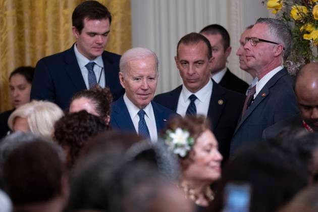 March 22, 2023, Washington, District of Columbia, USA: United States President Joe Biden walks to speak with guests at a reception celebrating Women™s History Month at the White House in Washington, DC, on March 22, 2023 Washington USA - ZUMAs152 20230322_zaa_s152_137 Copyright: xChrisxKleponisx