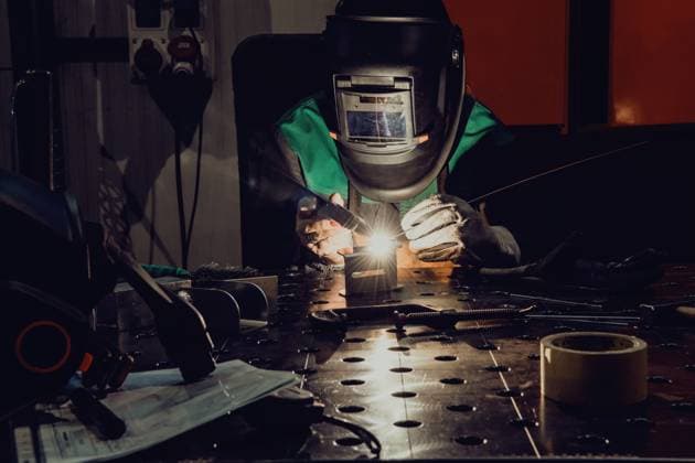 A woman employed in a modern factory for the production and processing of metals in a work uniform welding metal materials A woman employed in a modern factory for the production and processing of metals in a work uniform welding metal materials. High quality photo ,model released, Symbolfoto ,property released Copyright: xZoonar.com benisxarapovicx 17286456 ,model released, Symbolfoto ,property released