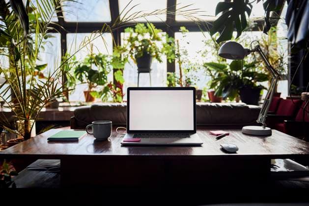 Laptop with blank screen on desk at loft office property released, BSZF02262