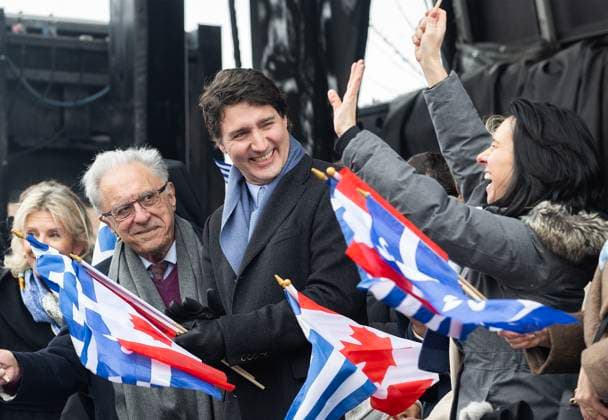 March 26, 2023, Montreal, PQ, Canada: Prime Minister Justin Trudeau, centre, looks on as Montreal Mayor Valerie Plante, right, waves to the crowd as they attend the Greek Independence Day Parade in Montreal, Sunday, March 26, 2023. Montreal Canada - ZUMAc35_ 20230326_zaf_c35_029 Copyright: xGrahamxHughesx