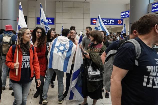 March 27, 2023, Jerusalem, Israel: Tens of thousands of demonstrators arrive from around the country at JerusalemÃ¢â‚¬â ¢s Itzhak Navon Train Station to protest outside the Knesset, the Israeli Parliament. A general strike has been announced nationwide, shutting down universities, outgoing international flights and medical services following NetanyahuÃ¢â‚¬â ¢s dismissal of Defense Minister Galant for publicly announcing his opposition to legislation overhauling the judiciary system giving NetanyahuÃ¢â‚¬â ¢s government a path to override Supreme Court decisions. Many perceive proposed legislation could undermine the foundations of democracy, undermine the independence of the judicial and law enforcement, upset the balances between the state - ZUMAa126 20230327_zap_a126_025 Copyright: xNirxAlonx