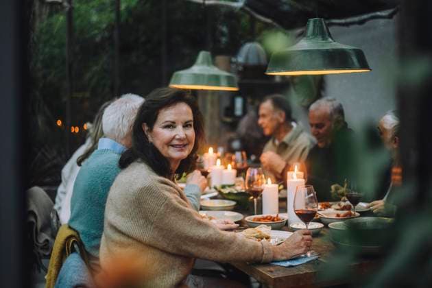 Portrait of smiling senior woman enjoying with friends during dinner party Sweden, Stockholm, model released, property released Copyright: xMaskotx , MA100237 MA100237