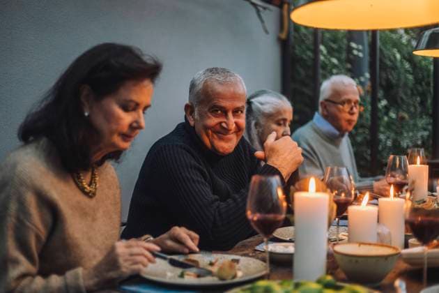 Portrait of smiling mature man with senior friends during dinner party Sweden, Stockholm, model released, property released Copyright: xMaskotx , MA100239 MA100239