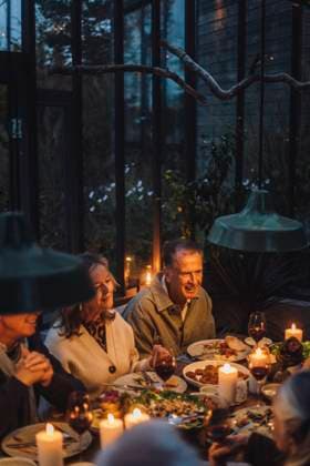 Happy senior male and female friends having food at dinner party Sweden, Stockholm, model released, property released Copyright: xMaskotx , MA100254 MA100254