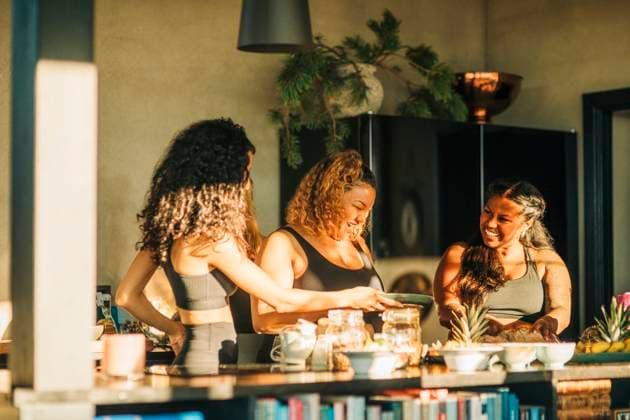 Happy female friends talking to each other while having breakfast at retreat center Sweden, Stockholm, model released, property released Copyright: xMaskotx , MA100340 MA100340