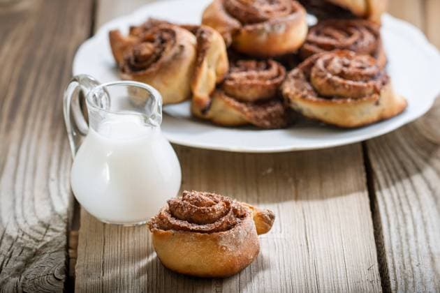 Cinnamon rolls Cinnamon rolls on a plate on a wooden background Copyright: xZoonar.com BurakovaxIrinax 13341185