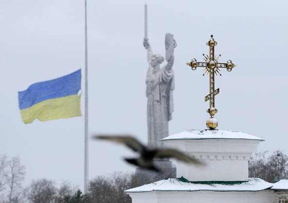Kyiv Pechersk Lavra In Kyiv, Amid Russian Invasion Of Ukraine A pigeon flies in front of a cross of Kyiv Pechersk Lavra and Motherland Monument that seen on background in Kyiv, Ukraine on 29 March 2023, amid Russian invasion of Ukraine. Reserve Kyiv-Pechersk Lavra terminates the lease agreement with the Ukrainian Orthodox Church accused of being linked to the Moscow Patriarchate, with the demand to move out of the monastery by 29 March, as local media reported. Since its foundation as the cave monastery in 1051, the Lavra has been a preeminent center of Eastern Orthodox Christianity in Eastern Europe. Together with the Saint Sophia Cathedral, the Kyiv Pechersk Lavra has been inscribed as a UNESCO World Heritage Site since 1990. Kyiv U  Copyright: xSTRx originalFilename: sindeyev-notitle230329_npSqu.jpg