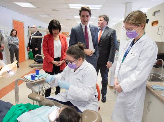 March 31, 2023, Moncton, NB, Canada: Prime Minister Justin Trudeau, centre, Minister Dominic LeBlanc, Intergovernmental Affairs, Infrastructure and Communities and Minister Ginette Petitpas Taylor, Official Languages and Minister responsible for the Atlantic Canada Opportunities Agency, speaks with dental hygienist students and patients at Oulton College in Moncton, N.B., on Friday, March 31, 2023. Moncton Canada - ZUMAc35_ 20230331_zaf_c35_064 Copyright: xRonxWardx