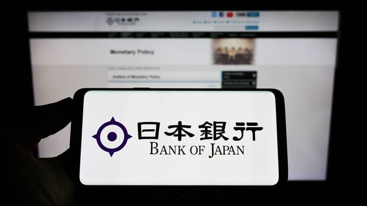 Person holding mobile phone with logo of financial institution Bank of Japan (BOJ) on screen. Stuttgart, Germany - 09-18-2022: Person holding mobile phone with logo of financial institution Bank of Japan (BOJ) on screen in front of web page. Focus on phone display. Copyright: xZoonar.com TimonxSchneiderx 19146070