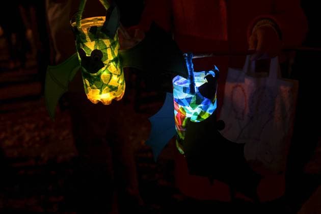 Homemade children lanterns glowing in the darkness on a traditional procession of lights on St. Martin s day at night, copy space, selected focus Homemade children lanterns glowing in the darkness on a traditional procession of lights on St. Martin s day at night, copy space, selected focus, narrow depth of field Copyright: xZoonar.com MARENxWINTERx 19393292