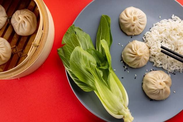 IMAGO Creative, Food, Dumplings Overhead view of asian dumplings, rice, endive and chopsticks on red background Overhead view of asian dumplings, rice, endive and chopsticks on red background. Asian tasty home cooked food and healthy eating., model released, , property released, Cape Town, South Africa, 14.07.2022, 3766918.jpg, overhead view,asian,dumpling,rice,endive,chopstick,red background,tasty,home,cooked,food,healthy eating,delicious,meal,cuisine,gourmet,fresh,dinner,lunch,snack,cooking,diet,dish,nutrition,sweet,healthy,dessert,organic,ingredient,plate,eat,meat,overhead,view,red,background,eating