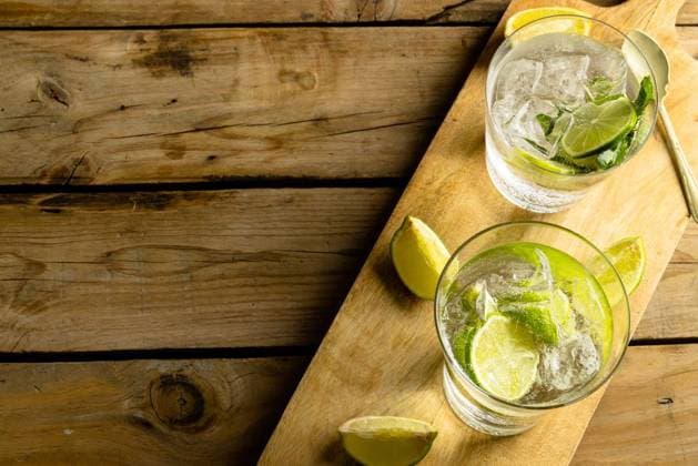 Glasses with water and limes on wooden board with copy space and wooden surface Glasses with water and limes on wooden board with copy space and wooden surface. Cocktail day and celebration concept., model released, , property released, Cape Town, South Africa, 2022-12-04T22:00:00.000Z, 3937644.jpg, glass,water,lime,wooden board,copy space,surface,cocktail,day,celebration,concept,holiday,background,design,abstract,blue,nature,decoration,sea,summer,drink,light,white,party,color,texture,liquid,symbol,illustration,beverage,beautiful,wooden,board,copy,space