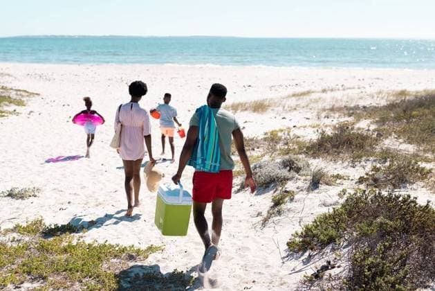 Rear view of african american family with swimming float, cooler walking at beach towards seascape Rear view of african american family with swimming float, cooler walking at beach towards seascape. Copy space, unaltered, parents, together, childhood, picnic, nature, vacation, enjoyment, summer., model released, , property released, Cape Town, South Africa, 19.01.2023, 3991010.jpg, people,rear view,african american,family,swimming,float,cooler,walking,beach,towards,seascape,copy space,unaltered,parent,together,childhood,picnic,nature,kid,mother,sea,ocean,little,daughter,coast,summer,vacation,sand,water,mom,fun,happiness,father,son,happy,outdoor,shore,love,rear,view,african,american,copy,space Mid Adult,Man,Male,Black,Woman,Female,Child,Gir