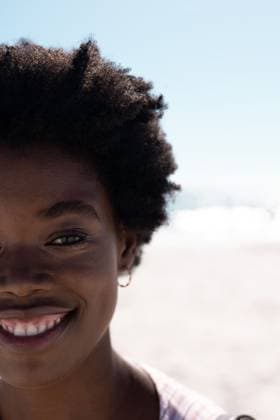 Cropped face of happy african american mid adult woman with afro hair at beach under clear sky Cropped face of happy african american mid adult woman with afro hair at beach under clear sky. Copy space, unaltered, vacation, nature, lifestyle, portrait, smiling, enjoyment and summer concept., model released, , property released, Cape Town, South Africa, 19.01.2023, 3991020.jpg, people,cropped,face,happy,african american,mid adult,woman,afro hair,beach,clear,sky,copy space,unaltered,vacation,nature,lifestyle,portrait,young,summer,beautiful,sea,travel,outdoor,landscape,person,ocean,water,adult,beauty,holiday,tourism,smile,blue,fun,attractive,coast,african,american,mid,afro,hair,copy,space Mid Adult,Woman,Female,Black