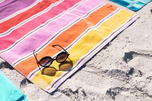 High angle view of sunglasses and colorful towel on sandy beach during sunny day High angle view of sunglasses and colorful towel on sandy beach during sunny day. Copy space, unaltered, protection, vacation, fashion, picnic and summer concept., model released, , property released, Cape Town, South Africa, 19.01.2023, 3991031.jpg, high angle,angle view,sunglass,colorful,towel,sandy beach,sunny day,copy space,unaltered,protection,vacation,fashion,picnic,summer concept,holiday,beautiful,color,summer,beauty,travel,style,beach,sea,tourism,blue,ocean,water,background,pattern,bright,art,safety,design,texture,high,angle,view,sandy,sunny,day,copy,space,concept