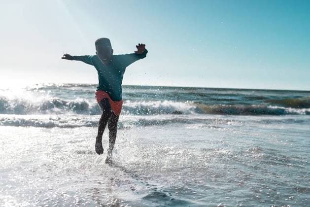 Full length of carefree african american boy running and splashing water in sea against clear sky Full length of carefree african american boy running and splashing water in sea against clear sky. Copy space, unaltered, childhood, nature, vacation, playing, enjoyment and summer concept., model released, , property released, Cape Town, South Africa, 19.01.2023, 3991069.jpg, people,full length,carefree,african american,boy,running,splashing water,sea,clear,sky,copy space,unaltered,childhood,nature,vacation,playing,enjoyment,ocean,summer,water,travel,landscape,beach,tourism,outdoor,blue,beautiful,coast,view,sun,kid,holiday,fun,leisure,tropical,sand,sunny,full,length,african,american,splashing,copy,space Child,Boy,Male,Black
