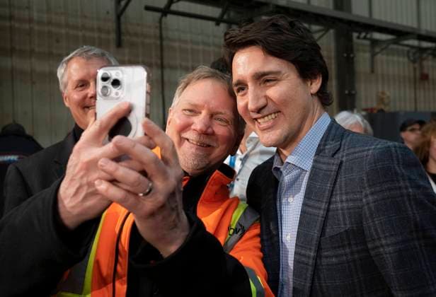 April 3, 2023, Val d Or, PQ, Canada: A worker poses for a photo with Prime Minister Justin Trudeau following a town hall meeting at a lithium mine near La Corne, Que., Monday, April 3, 2023. Val d Or Canada  - ZUMAc35_ 20230403_zaf_c35_132 Copyright: xAdrianxWyldx