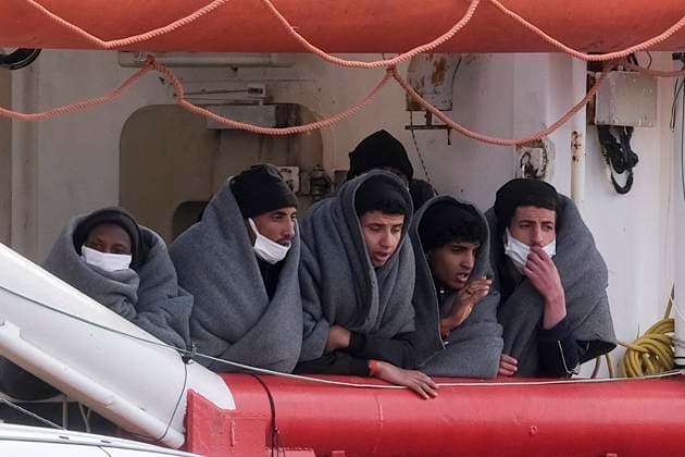 Five migrants face during disembarkation procedures the SOS Mediterranee NGO ship Ocean Viking rescued 92 people, including nine women and 40 unaccompanied minors, who were traveling in an overloaded and deflated dinghy in international waters off the coast of Libya. Ocean_Viking_0016 Copyright: xAntonioxBalascox