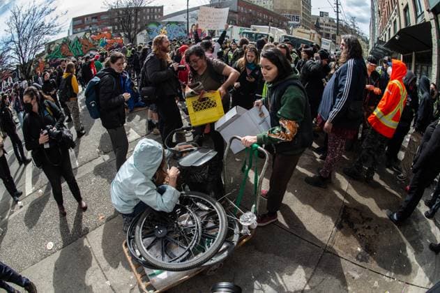 April 5, 2023, Vancouver, British Columbia, Canada: A woman is helped removing some personal belongings Hastings Street in Vancouver, Canada, as police and city crews remove a homeless encampment April 5. The City of Vancouver requested a heavy police presence for the safety of crews clearing the tents, temporary structures and personal effects of homeless residents who have camped on the sidewalk for about eight months, sometimes blocking the entrances of businesses and residencies. The move follows the closure of encampments in public parks two years ago at the onset of whatÃ¢â‚¬â ¢s now CanadaÃ¢â‚¬â ¢s worst affordable housing crisis. Motivating the latest sweep, officials cited a spike in fires, assaults, robberies and other public saf - ZUMAb217 20230405_zip_b217_005 Copyright: xQuinnxBenderx