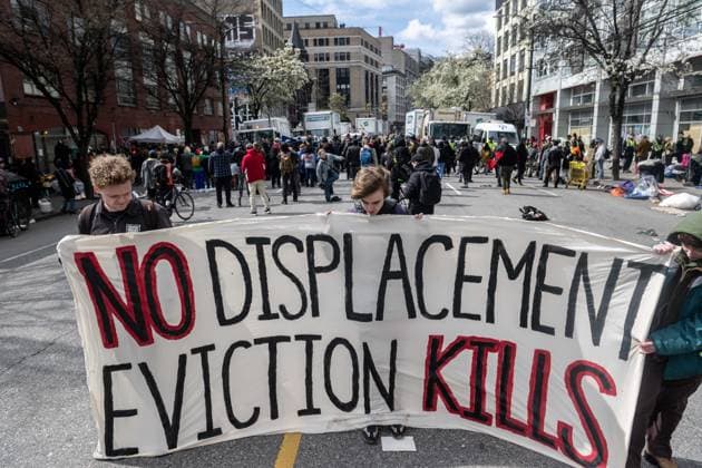 April 5, 2023, Vancouver, British Columbia, Canada: Demonstrators take to East Hastings Street in Vancouver, Canada, as police and city crews remove a homeless encampment. The City of Vancouver requested a heavy police presence for the safety of crews clearing the tents, temporary structures and personal effects of homeless residents who have camped on the sidewalk for about eight months, sometimes blocking the entrances of businesses and residencies. The move follows the closure of encampments in public parks two years ago at the onset of whatÃ¢â‚¬â ¢s now CanadaÃ¢â‚¬â ¢s worst affordable housing crisis. Motivating the latest sweep, officials cited a spike in fires, assaults, robberies and other public safety concerns in a neighbourhood wi - ZUMAb217 20230405_zip_b217_008 Copyright: xQuinnxBenderx