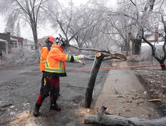 April 6, 2023, Montreal, PQ, Canada: City workers clears fallen branches Thursday, April 6, 2023 after yesterdayöÄÃ s ice storm which left over a million customers without power in Montreal. Montreal Canada  - ZUMAc35_ 20230406_zaf_c35_080 Copyright: xRyanxRemiorzx