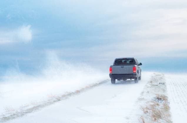 Pick-Up Truck on road in winter with heavy wind Pick-Up Truck on road in winter with heavy wind Copyright: xZoonar.com EwaldxFrx 19714986