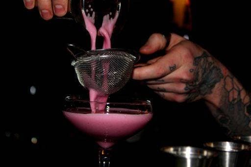 RECORD DATE NOT STATED A closeup of a tasty pink cocktail in a bar *** einer closeupe des einer schmackhaft Rosa Cocktailbereich ÊIn einer Balken 10568134
