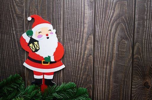 RECORD DATE NOT STATED A closeup of a Christmas decorative Santa on wooden background *** einer closeupe des einer Weihnachten Dekorativ Santa am hölzern Hintergrund 1189882