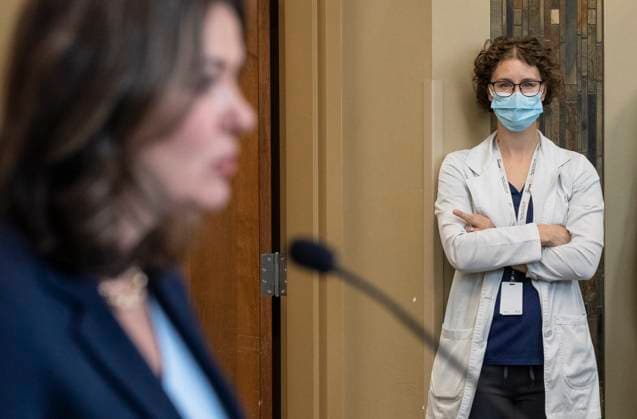 April 11, 2023, SHERWOOD PARK, AB, CANADA: A healthcare worker gives the middle finger as Alberta Premier Danielle Smith announces a public health guarantee in Sherwood Park, Alta., Tuesday, April 11, 2023. SHERWOOD PARK CANADA  - ZUMAc35_ 20230411_zaf_c35_018 Copyright: xJasonxFransonx