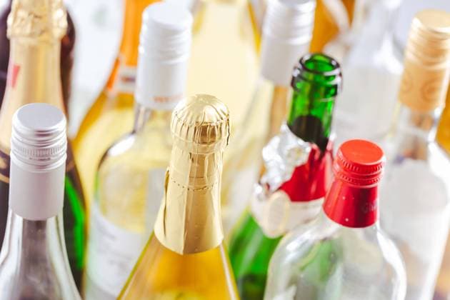 Full and empty bottles of different alcoholic drinks Full and empty bottles of different alcoholic drinks, abuse and alcohol addiction. Alcoholism concept. Copyright: xZoonar.com IngridxBalabanovax 19797993