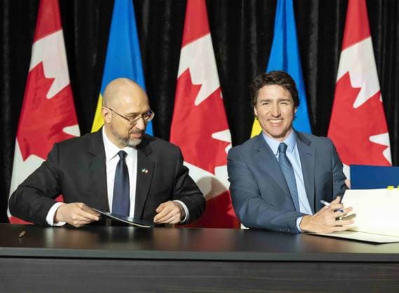 April 11, 2023, TORONTO, ON, CANADA: Ukrainian Prime Minister Denys Shmyhal and Prime Minister Justin Trudeau sign an agreement in Toronto, Tuesday, April 11, 2023. TORONTO CANADA  - ZUMAc35_ 20230411_zaf_c35_034 Copyright: xFrankxGunnx