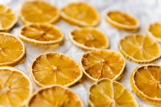Slices of dried lemon lying on white paper Slices of dried lemon lying on white paper Copyright: xZoonar.com ROBERTxRUIDLx 15306018