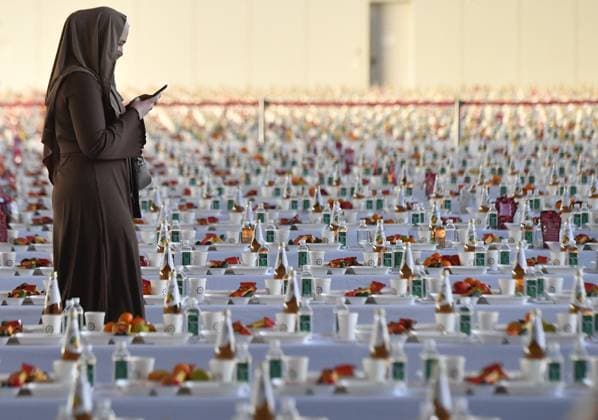 News Bilder des Tages Russia Religion Ramadan Iftar 8412808 15.04.2023 A Muslim woman walks past served tables at the 11th Republican Iftar, breaking of the fast, during the holy month of Ramadan at the Kazan Expo Exhibition Center in Kazan, Republic of Tatarstan, Russia. Maksim Bogodvid Sputnik Kazan Republic of Tatarstan Russia  Copyright: xMaksimxBogodvidx