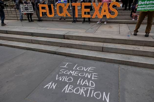 April 15, 2023, New York, New York, USA: Chalking on the sidewalk reads I love someone who had an abortion and a sign reads Ã¢â‚¬oeFuck Texas.Ã¢â‚¬Â On a national day of action to protest the court battle to restrict access to mifepristone, used for medication abortion, pro-abortion activists rallied on the steps of the 42nd St branch of the New York Public Library to call for an end to abortion bans. New York USA - ZUMAr174 20230415_znp_r174_015 Copyright: xGinaxMxRandazzox