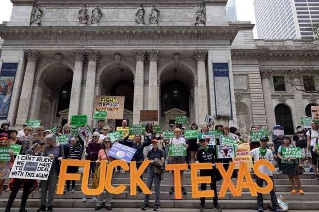 April 15, 2023, New York, New York, USA: On a national day of action to protest the court battle to restrict access to mifepristone, used for medication abortion, pro-abortion activists rallied on the steps of the 42nd St branch of the New York Public Library to call for an end to abortion bans. A sign reads Ã¢â‚¬oeFuck Texas. New York USA - ZUMAr174 20230415_znp_r174_029 Copyright: xGinaxMxRandazzox