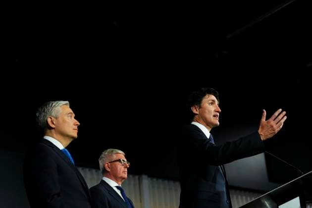April 17, 2023, Ottawa, ON, CAN: Prime Minister Justin Trudeau speaks as he is joined by Borje Ekholm, centre, President and CEO of Ericsson and Minister of Innovation, Science and Industry Francois-Philippe Champagne during an announcement and press conference at Ericsson in Ottawa on Monday, April 17, 2023. Ottawa CAN  - ZUMAc35_ 20230417_zaf_c35_028 Copyright: xSeanxKilpatrickx