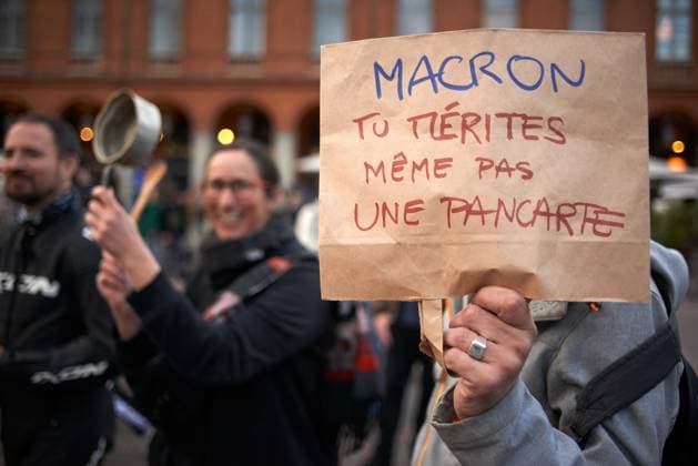 Pot Concert During Macron s Speech On Tvs And Radios A protester shows a paper bag reading Macon, you won t even deserve a placard . A few thousands people gathered in front of the Capitole in Toulouse for a pot concert at the same French President Macron spoke on TVs and radios. They are angered by the decision to validate the pension bill by the consitutional council and its promulgation by Macron soon after. The pension bill will delay retirement by two years to 64 and was pushed through parliament by the government without a vote.Polls show 64% french people say they want the stirkes to intensify and that 93% of workers oppose the pension reform. The retirement age would be raised to 64 years (for 43 years of continued work) and the pe  Copyright: xAlainxPittonx originalFilename: pitton-notitle230417_np8kK.jpg