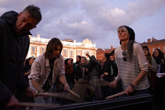 Pot Concert During Macron s Speech On Tvs And Radios People play drums on a trash bin during the pot concert in toulouse. A few thousands people gathered in front of the Capitole in Toulouse for a pot concert at the same French President Macron spoke on TVs and radios. They are angered by the decision to validate the pension bill by the consitutional council and its promulgation by Macron soon after. The pension bill will delay retirement by two years to 64 and was pushed through parliament by the government without a vote.Polls show 64% french people say they want the stirkes to intensify and that 93% of workers oppose the pension reform. The retirement age would be raised to 64 years (for 43 years of continued work) and the pensions will  Copyright: xAlainxPittonx originalFilename: pitton-notitle230417_npSB6.jpg