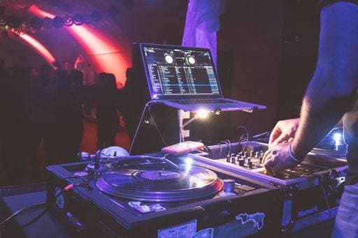 RECORD DATE NOT STATED A closeup of a DJ playing techno music during a party in a club *** einer closeupe des einer Diskjockey spielendes techno Musik während einer Fest ÊIn einer Klub 2496259