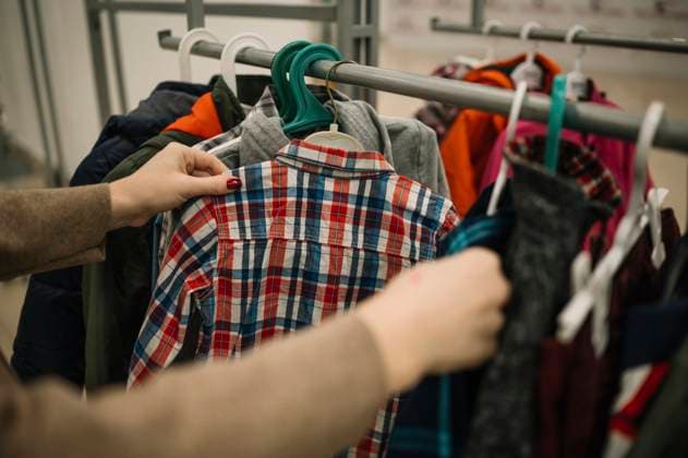 Hands of woman choosing clothes at store model released, Symbolfoto property released, ANAF01160