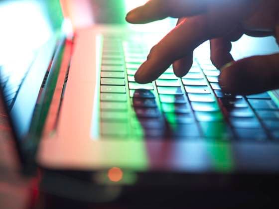 Hands typing on laptop keyboard in dark at home office model released, Symbolfoto property released, ABRF01072
