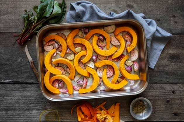 Sliced onions, pumpkins and common beets on baking sheet, EVGF04320